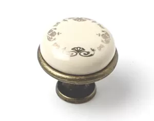 81038 - knopka 28mm porc.slon. kost/zlatý ornament